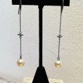 Long Pearl drop earrings with cubic zirconia detail